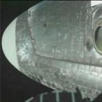 Robot arm's color camera checks shuttle port side