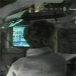 Commander Collins guides Discovery to docking