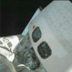 Robot arm checks Discovery's starboard side