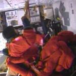 Mission specialist Charlie Camarda boards Discovery