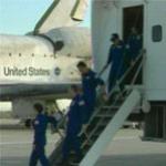 Astronauts egress from the shuttle