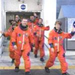 Astronauts depart quarters for launch pad