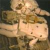 Spacewalkers retrieve tripod for external TV camera