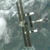 Discovery flies above the station