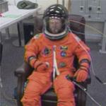 Crew gets dressed for the trip to orbit
