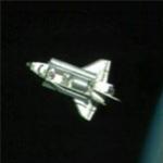 Discovery pulls in front of station for docking